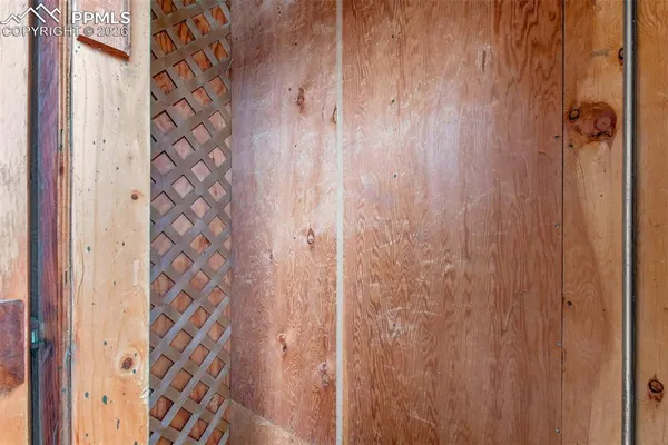 a view of a balcony with wooden floor