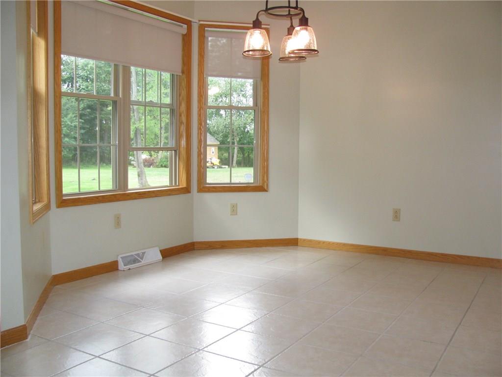 161 Donation Road Greenville, PA 16125 - Photo 11 of 25 TILED FLOOR IN THE KITCHEN DINING AREA. WINDOWS OVER LOOK THE REAR TREED YARD.