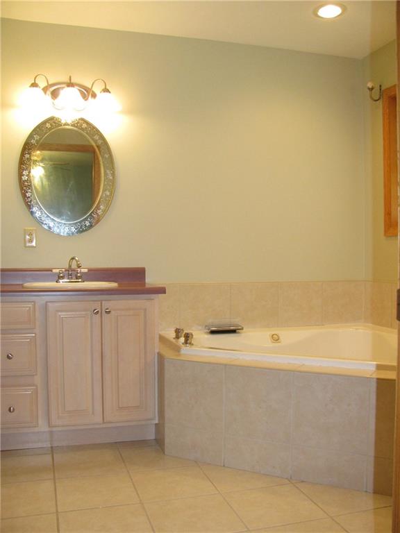 161 Donation Road Greenville, PA 16125 - Photo 19 of 25 MASTER B.R. FEATURES 2 SINKS/JET TUB W/WATERFALL FAUCET/STANDING SHOWER AND TILE FLOORING