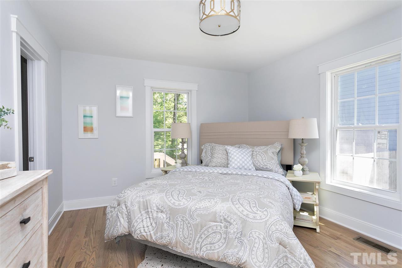 111 Bart Street Raleigh, NC 27610 - Photo 13 of 22 a bedroom with a bed and a window