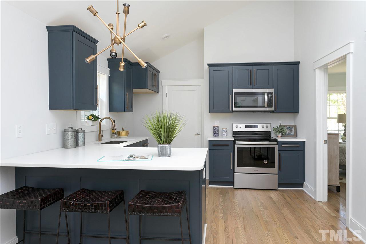 111 Bart Street Raleigh, NC 27610 - Photo 5 of 22 a kitchen with a sink and stainless steel appliances