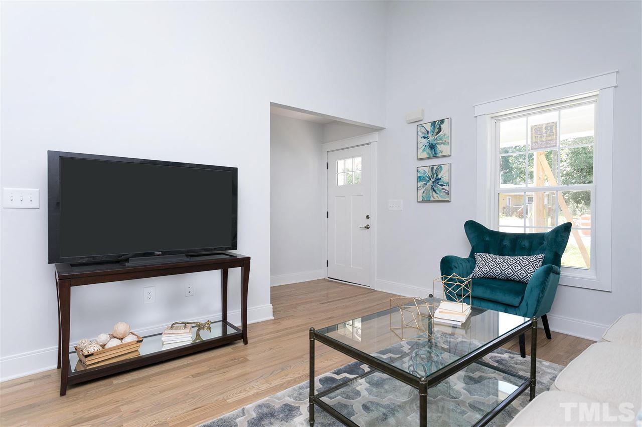111 Bart Street Raleigh, NC 27610 - Photo 10 of 22 a living room with furniture and a flat screen tv