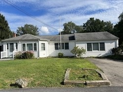 6 A Maple Avenue, Unit 6A Scituate, MA 02066 - Photo 1 of 21 a front view of a house with a yard
