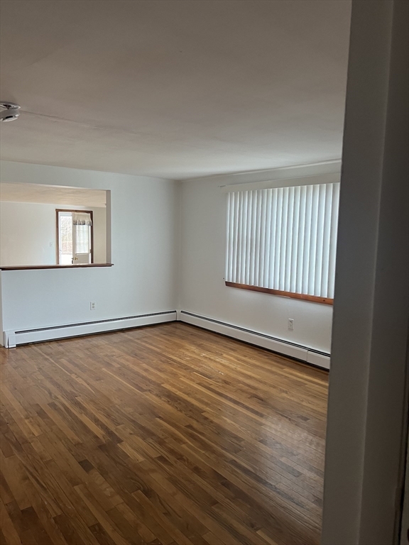 6 A Maple Avenue, Unit 6A Scituate, MA 02066 - Photo 12 of 21 wooden floor in an empty room with a window