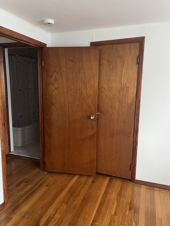 6 A Maple Avenue, Unit 6A Scituate, MA 02066 - Photo 18 of 21 an empty room with wooden floor and closet area