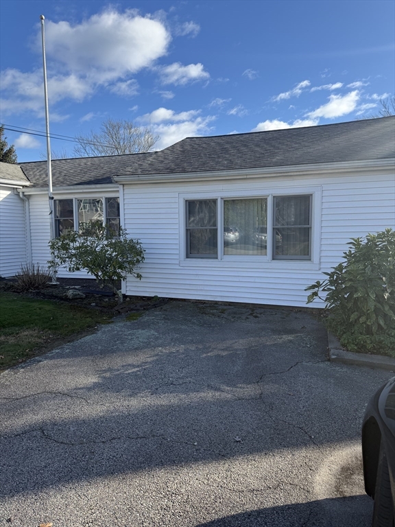 6 A Maple Avenue, Unit 6A Scituate, MA 02066 - Photo 3 of 21 a front view of a house with a yard