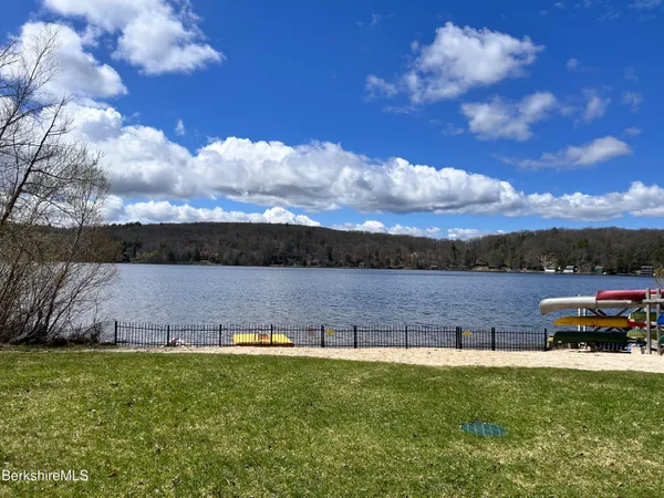 a view of a lake with houses in the back