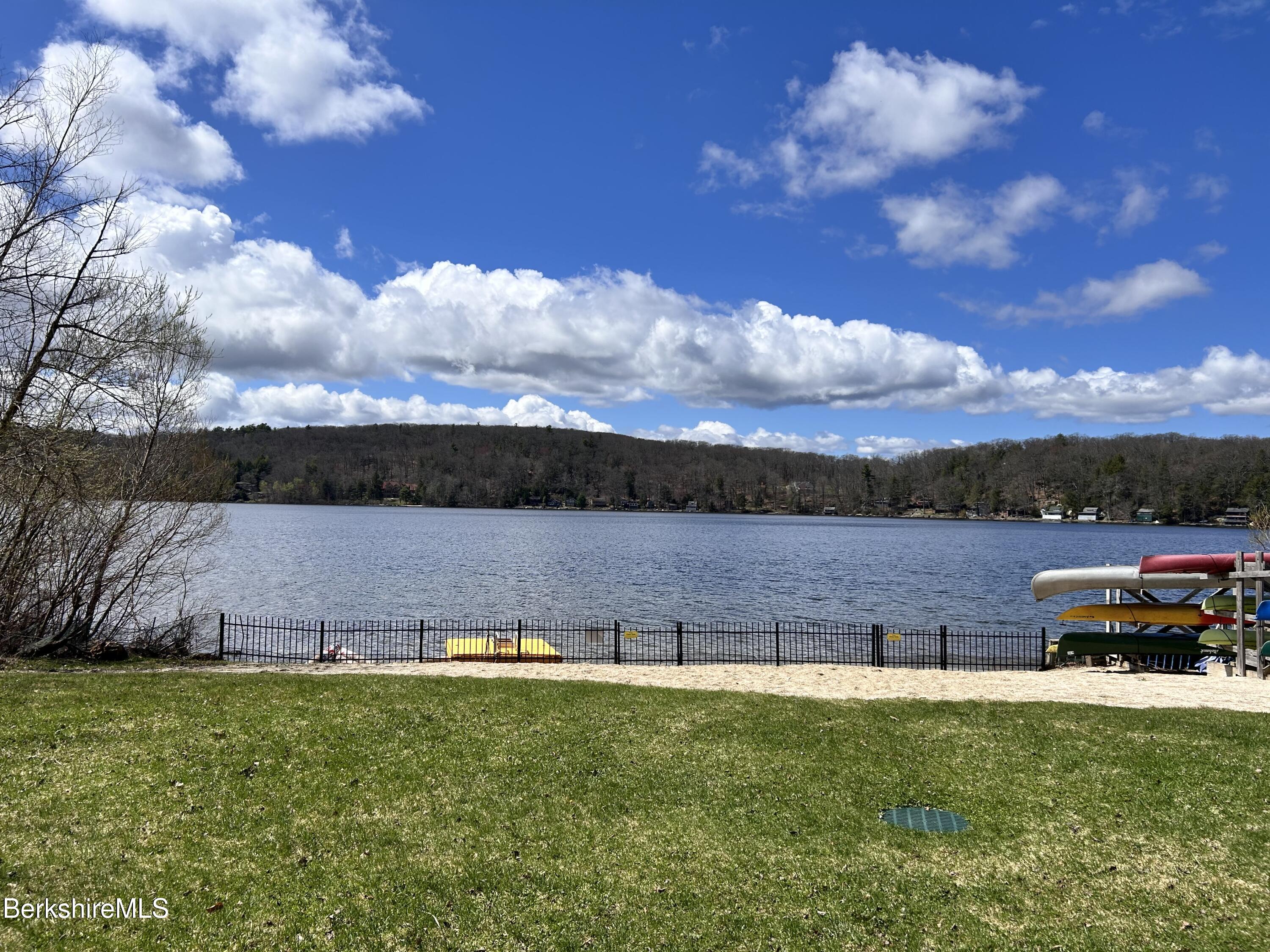 a view of a lake with houses in the back