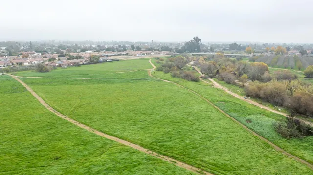 a view of a lake with a yard