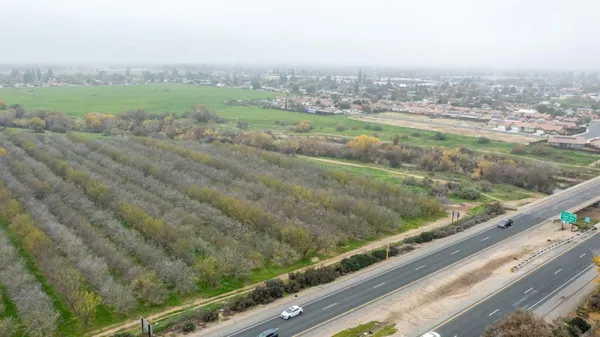a view of a field with an outdoor space
