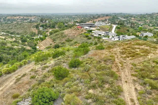 a view of a field with an ocean