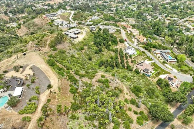 a aerial view of residential houses with yard
