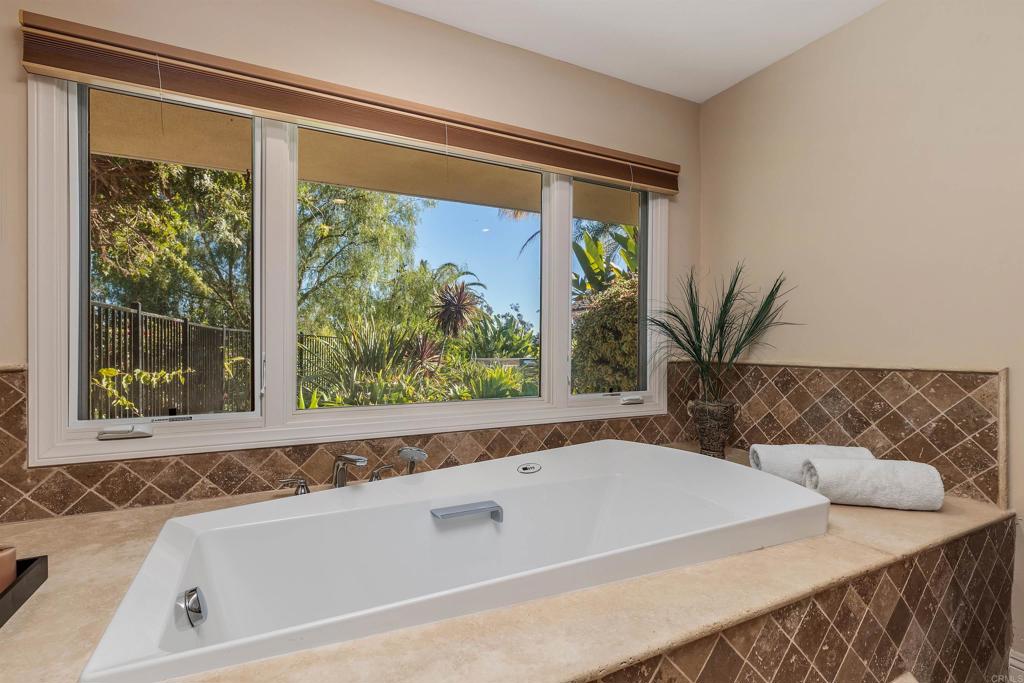 16346 Via Del Alba Rancho Santa Fe, CA 92067 - Photo 17 of 34 a bath tub sitting in front of a window