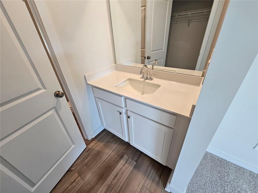 2690 Harbor Rdg Pass Gainesville, GA 30507 - Photo 16 of 19 a bathroom with a sink and a mirror