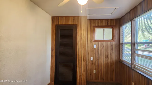 a view of a hallway with windows