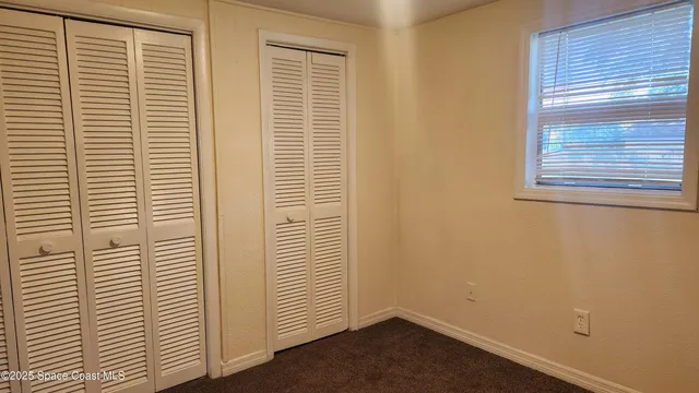 a view of a room that has a window in it