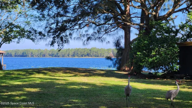 a view of swimming pool with an outdoor space and seating area