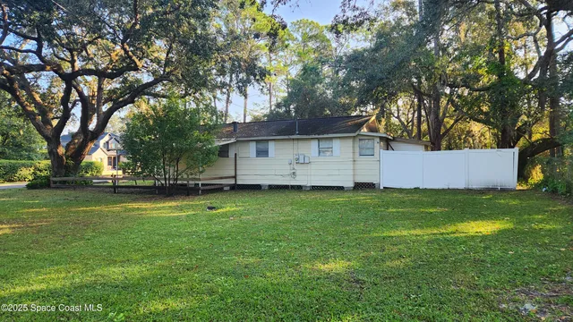 a backyard of a house with lots of green space
