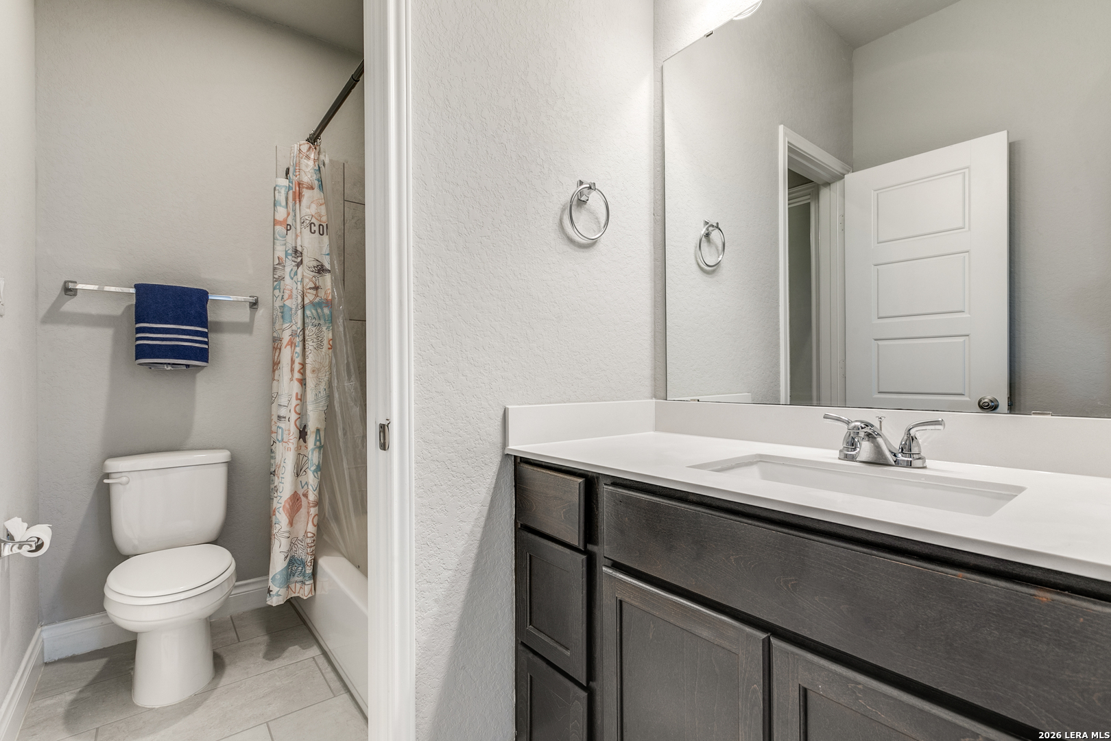 331 Ricadonna San Antonio, TX 78253 - Photo 20 of 28 a bathroom with a granite countertop sink a toilet and a mirror