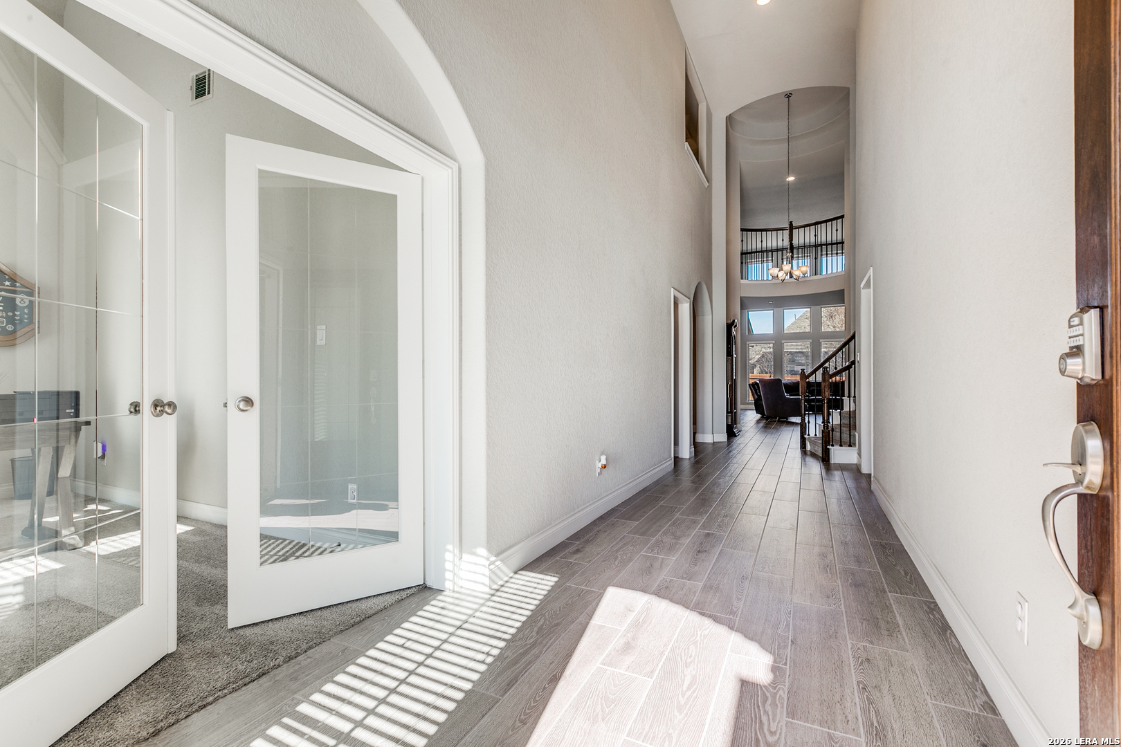 331 Ricadonna San Antonio, TX 78253 - Photo 3 of 28 a view of a hallway with wooden floor and a living room