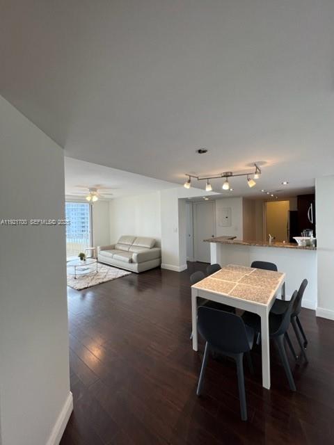 770 Claughton Island Drive, Unit 1404 Miami, FL 33131 - Photo 12 of 23 a view of a dining room with furniture and window