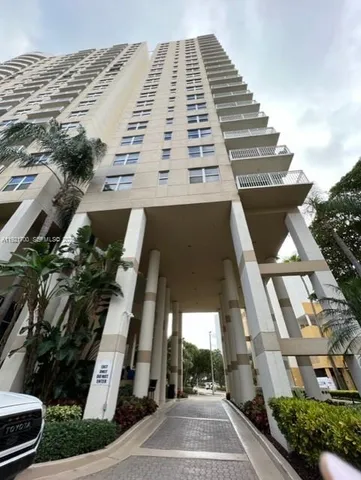 a kitchen with stainless steel appliances granite countertop a sink a stove and a view of living room