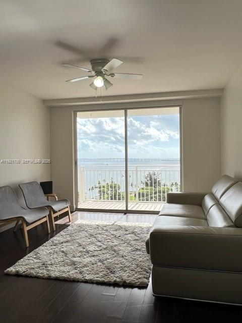 770 Claughton Island Drive, Unit 1404 Miami, FL 33131 - Photo 10 of 23 a living room with furniture and a large window