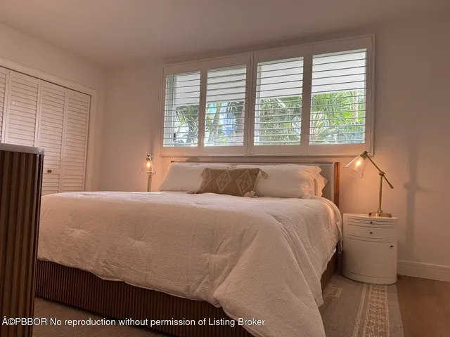 a bathroom with a sink shower and a mirror