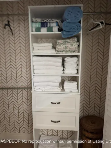 a bathroom with a shower sink and mirror