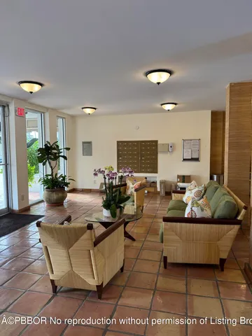 a view of a dining room with furniture and a rug