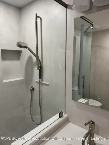 a lobby with furniture and a potted plant