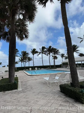 a lobby with furniture and a dining table