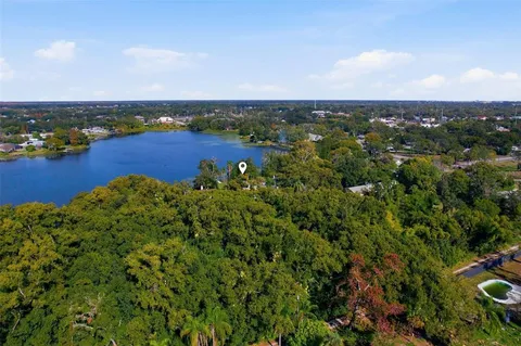a en suite bathroom with a sink and a large mirror