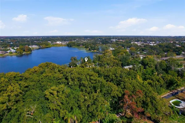 a en suite bathroom with a sink and a large mirror