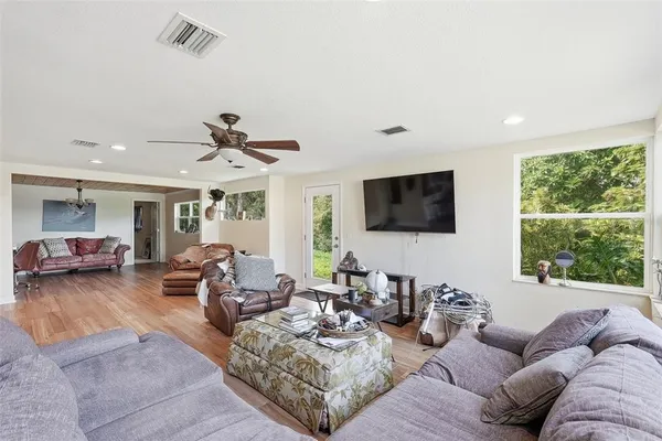 a kitchen with stainless steel appliances granite countertop a stove refrigerator and microwave