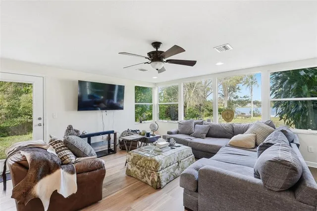 a kitchen with granite countertop wooden cabinets stainless steel appliances and a window