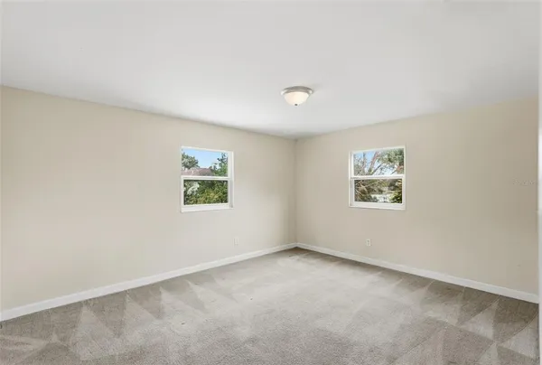 a view of a house with a yard and garage