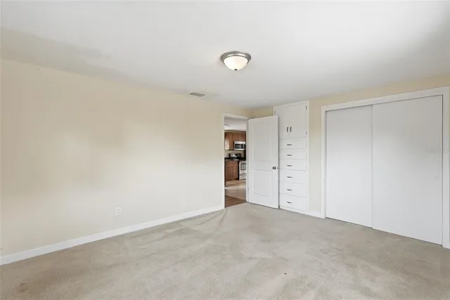 a view of a house with a yard and garage