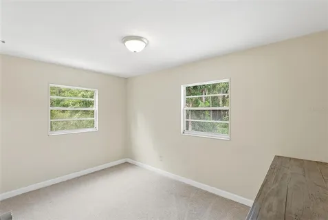 a backyard of a house with lots of green space