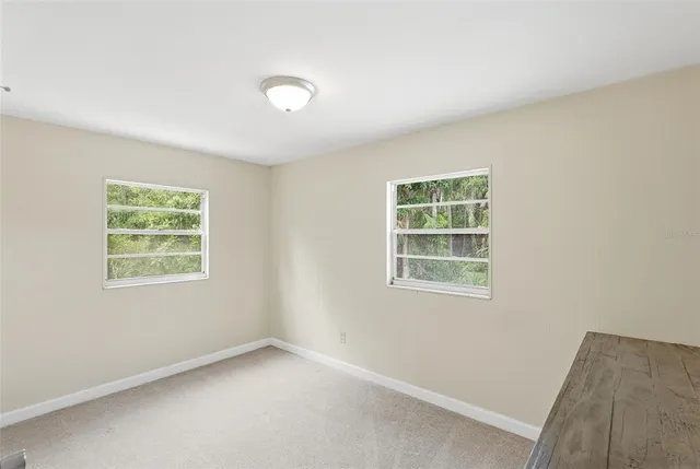 a backyard of a house with lots of green space