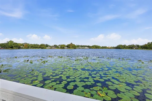 a view of a lake with wooden floor and city view