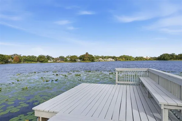 an aerial view of a house with a yard and garden