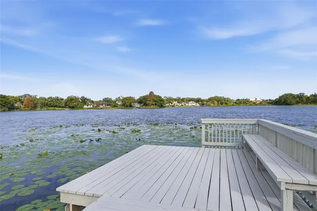 an aerial view of a house with a yard and garden