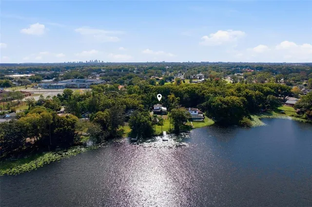 a living room with furniture ceiling fan and a flat screen tv