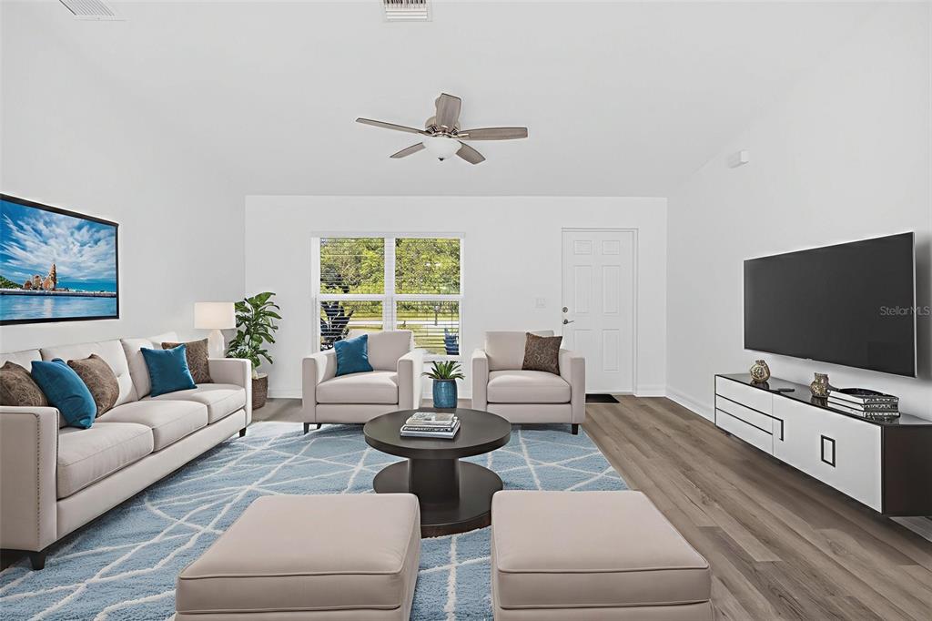 11145 2nd Avenue Punta Gorda, FL 33955 - Photo 4 of 9 a living room with furniture and a flat screen tv