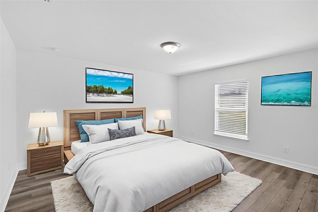 11145 2nd Avenue Punta Gorda, FL 33955 - Photo 6 of 9 a bedroom with a large bed and a window