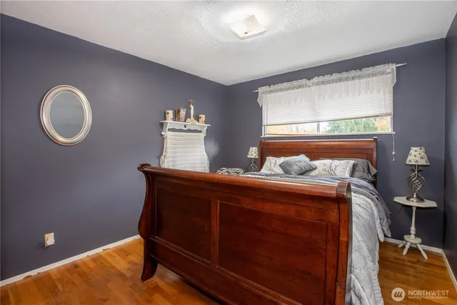 a bed room with a bed and a window