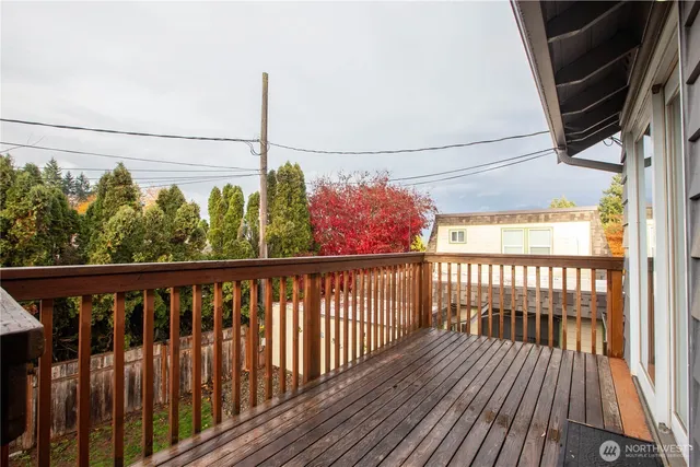 a view of a balcony with wooden floor
