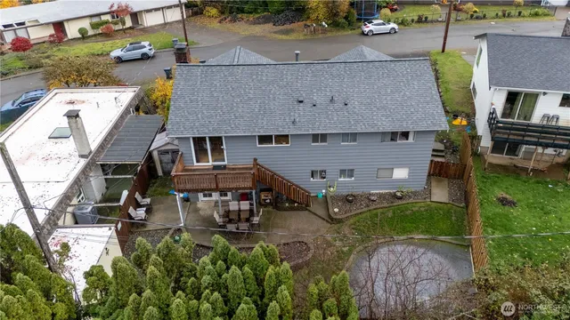 an aerial view of a house with swimming pool