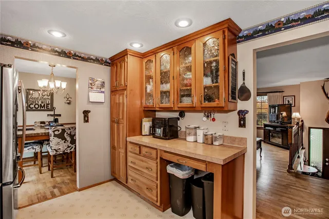 a kitchen with stainless steel appliances granite countertop a sink and cabinets